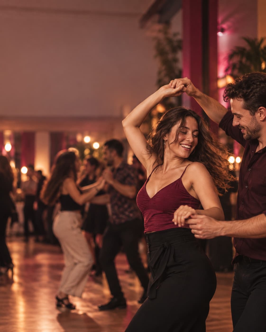 A couple dancing salsa at a social dancing event